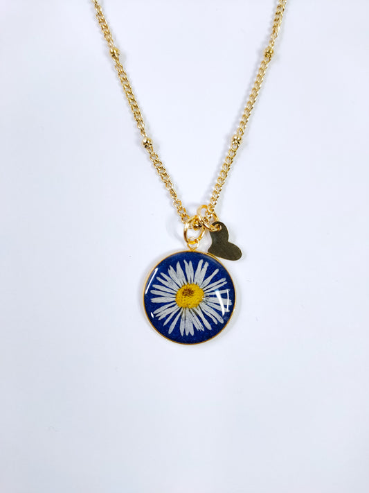 Collana in acciaio inossidabile con ciondolo a cerchio in resina di colore blu e fiore Margherita